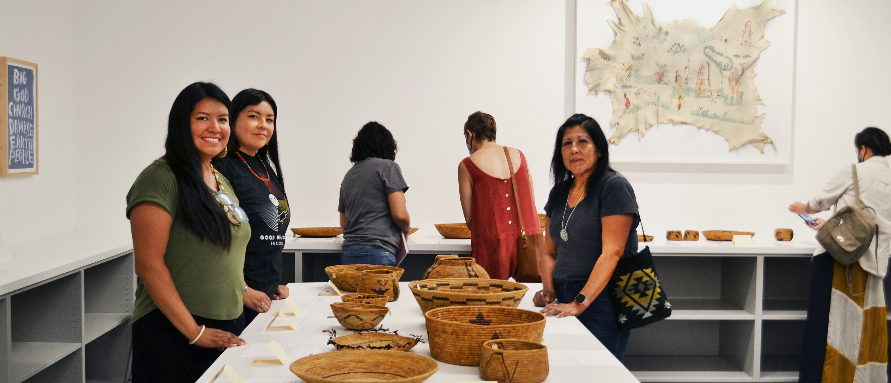 group of women standing around table with baskets