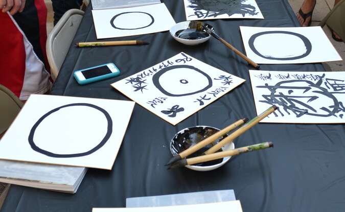 Calligraphy boards with brushs and circular strokes