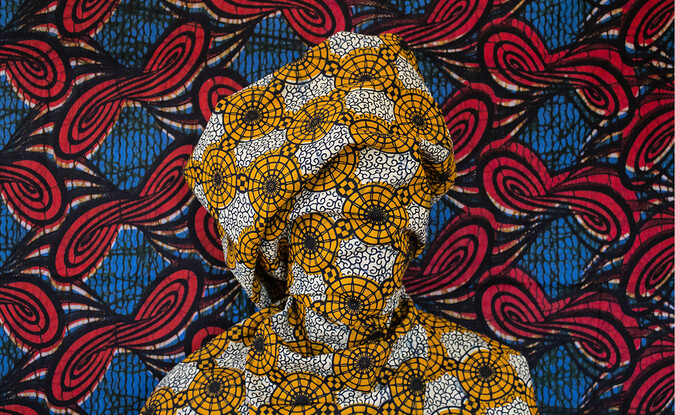 Bust wrapped in yellow white patterned fabric 