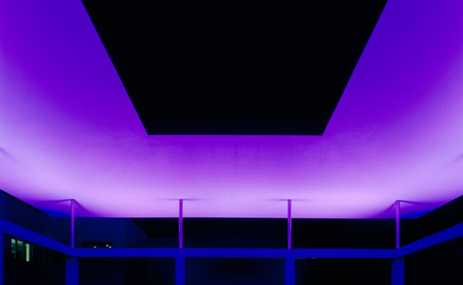 Nighttime view of the James Turrell Skyspace with purple lighting