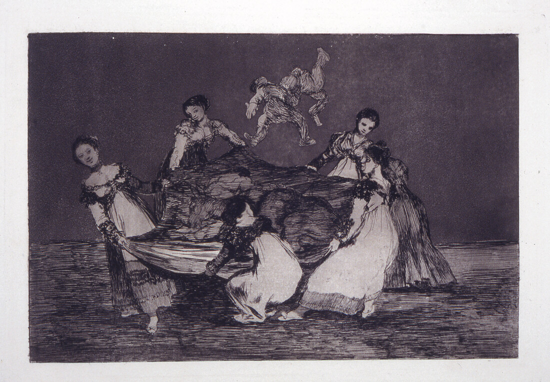 Scene of several people pulling on a central fabric