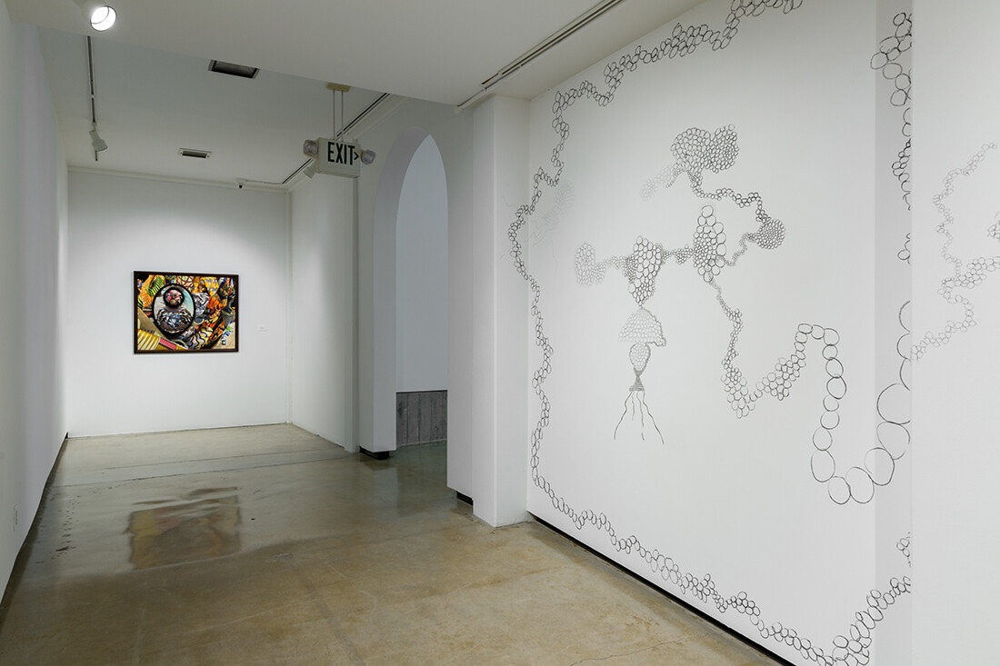 Installation view of exhibition with composite photographs mounted on walls