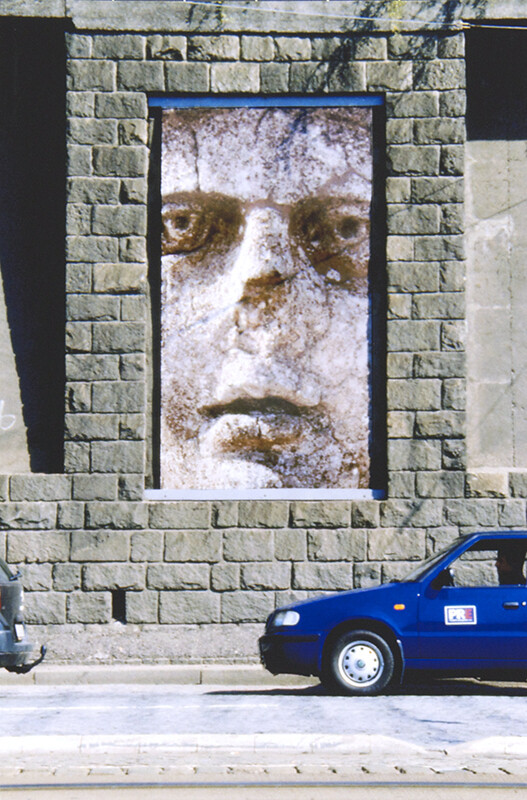 Facce Murate (Walled Faces), with Alessandro Alimonti (2005, Prague) (one enlarged to fit entire space, floor to ceiling, and the small images of the whole series: 6 photographs 11 1/8 x 7 3/8 in. (28.26 x 18.73 cm) each. Pomona College Collectio