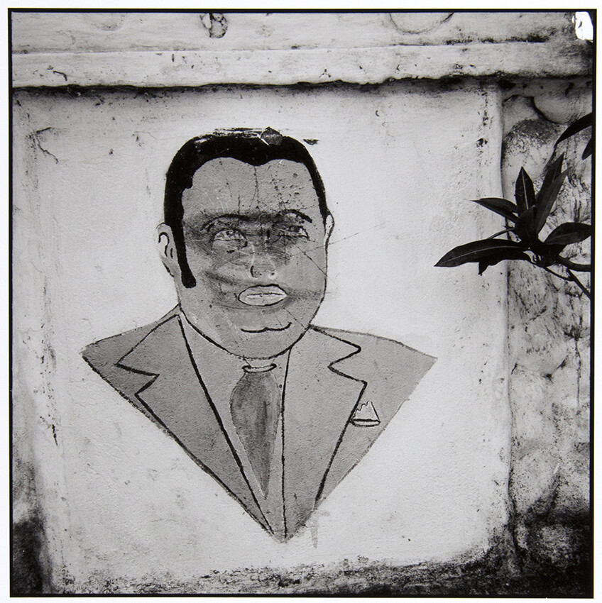 Danny Lyons, Baby Doc. Defaced mural in Léogâne, 1983-86, Silver gelatin print, 8 x 8 in.