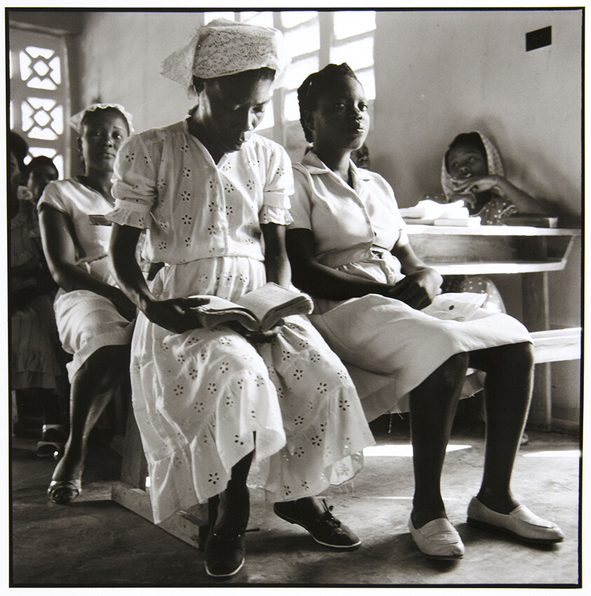Danny Lyons, Haiti, 1983-86 (Women seated, one reading book), 1983-86, Silver gelatin print, 10 x 9 3/4 in.