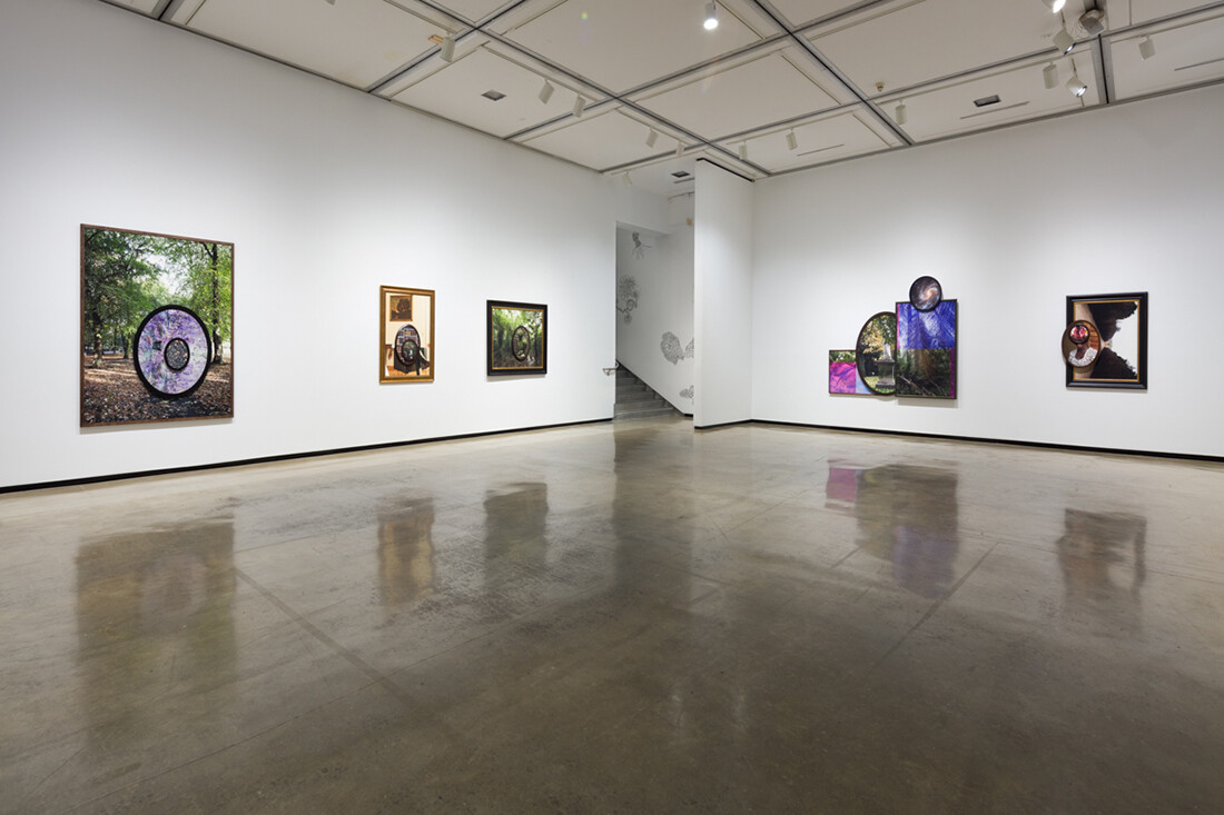 Installation view of exhibition with composite photographs mounted on walls