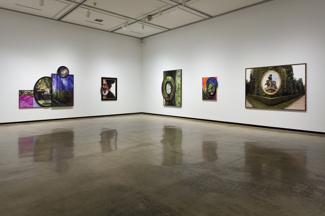 Installation view of exhibition with composite photographs mounted on walls