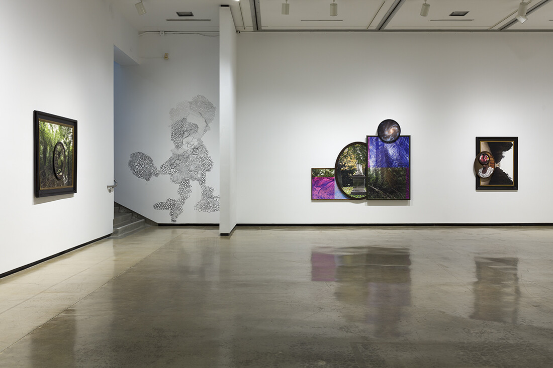 Installation view of exhibition with composite photographs mounted on walls