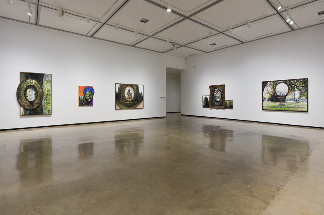 Installation view of exhibition with composite photographs mounted on walls