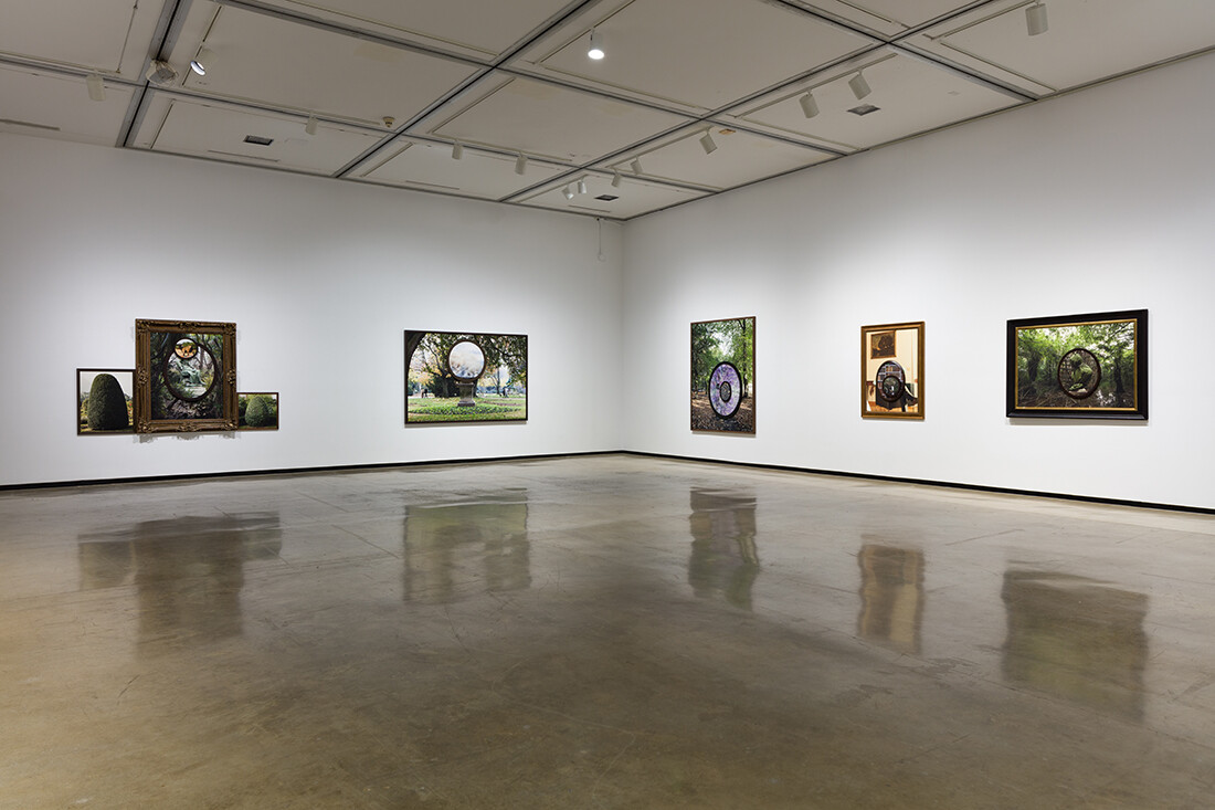Installation view of exhibition with composite photographs mounted on walls