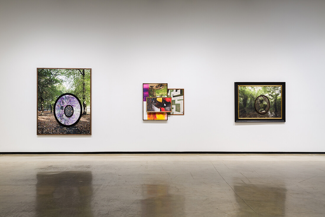 Installation view of exhibition with composite photographs mounted on walls