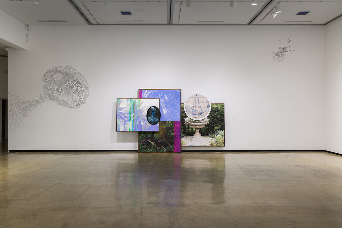 Installation view of exhibition with composite photographs mounted on walls