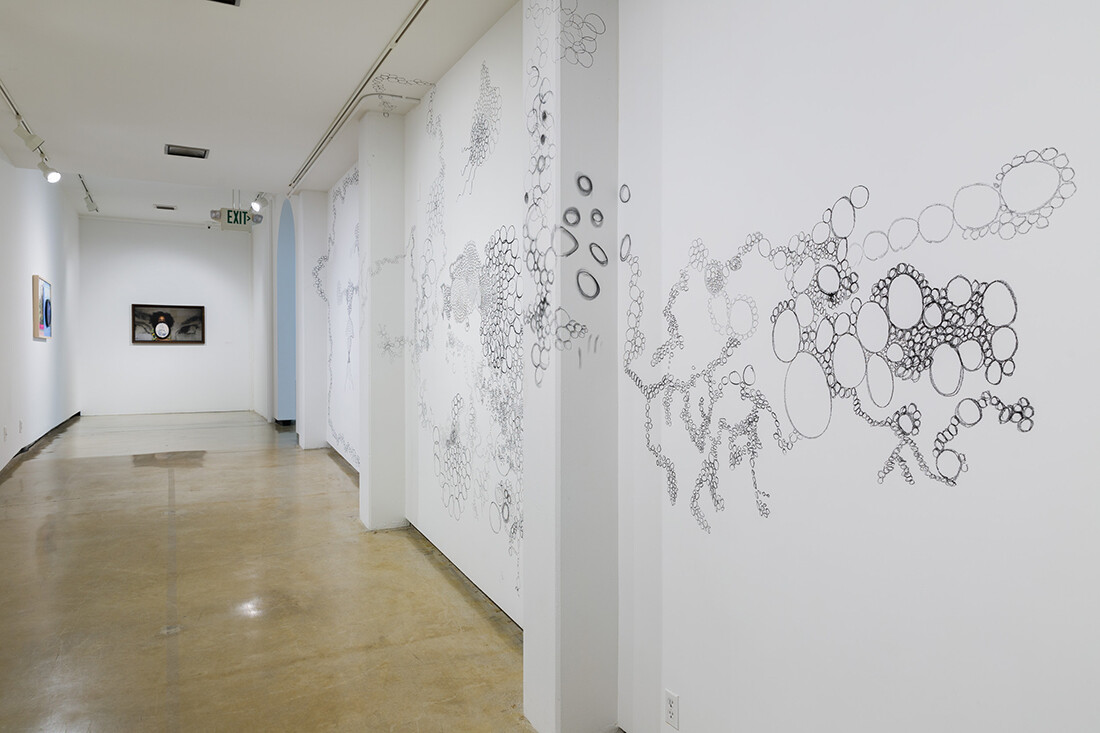 Installation view of exhibition with composite photographs mounted on walls
