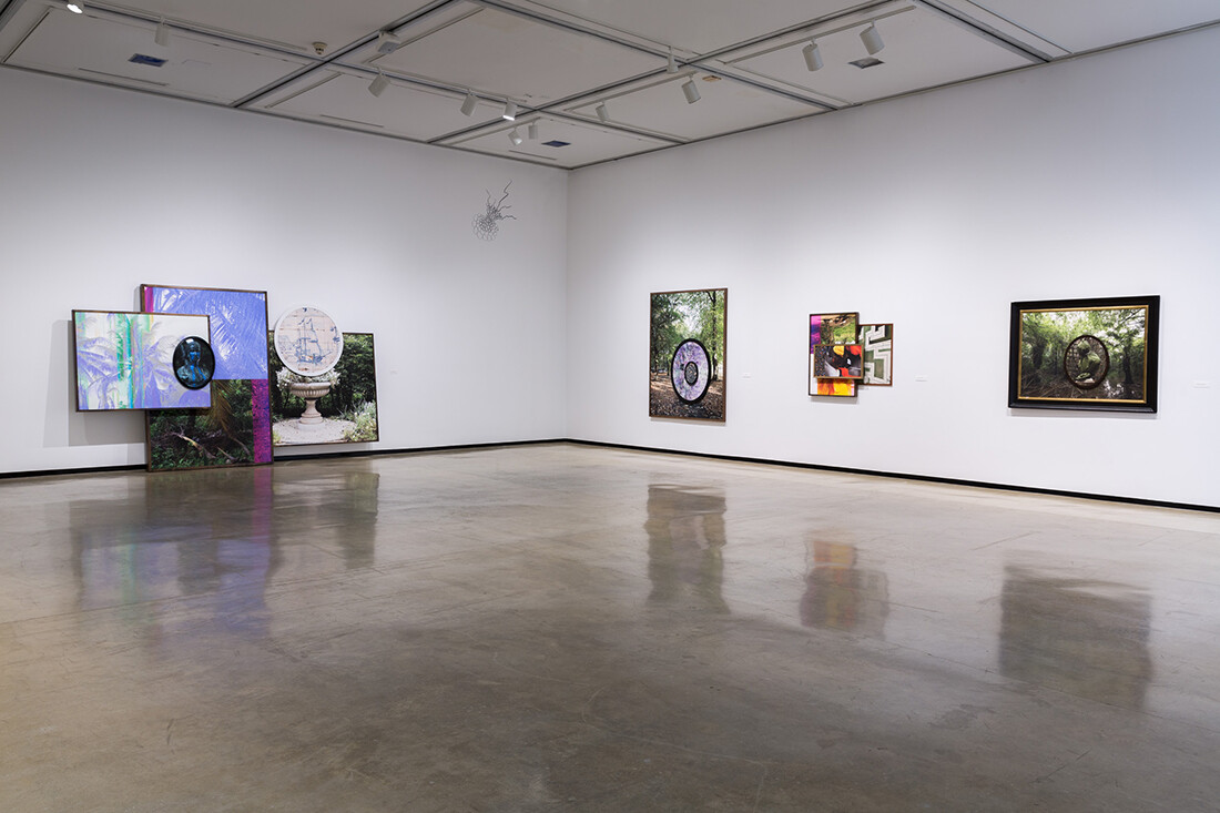 Installation view of exhibition with composite photographs mounted on walls