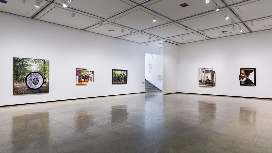 Installation view of exhibition with composite photographs mounted on walls