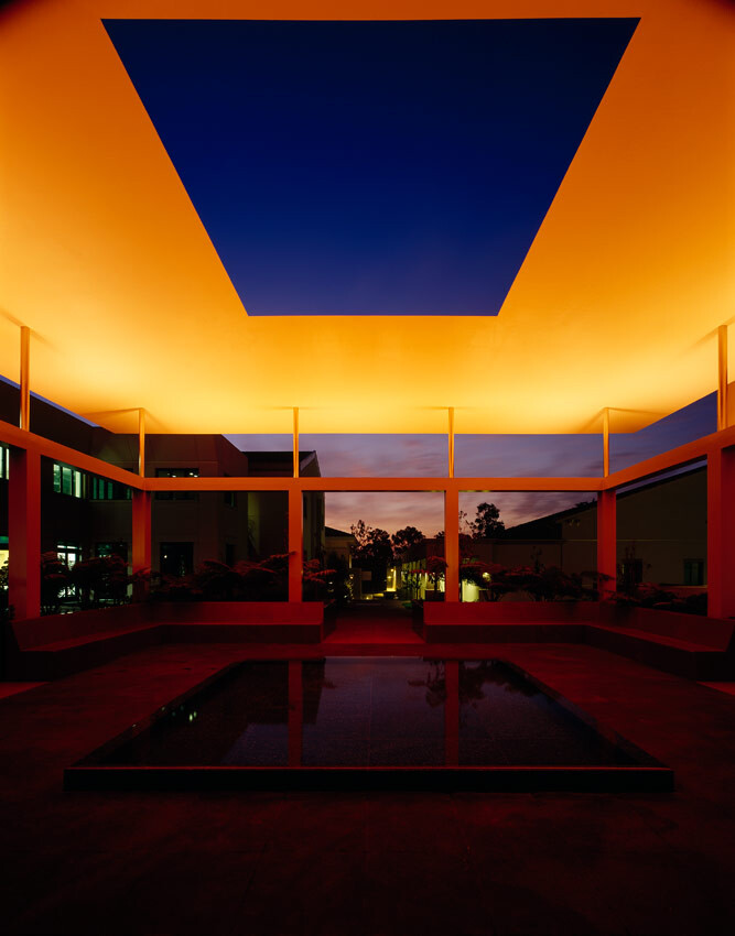 Nighttime view of the James Turrell Skyspace with orange lighting