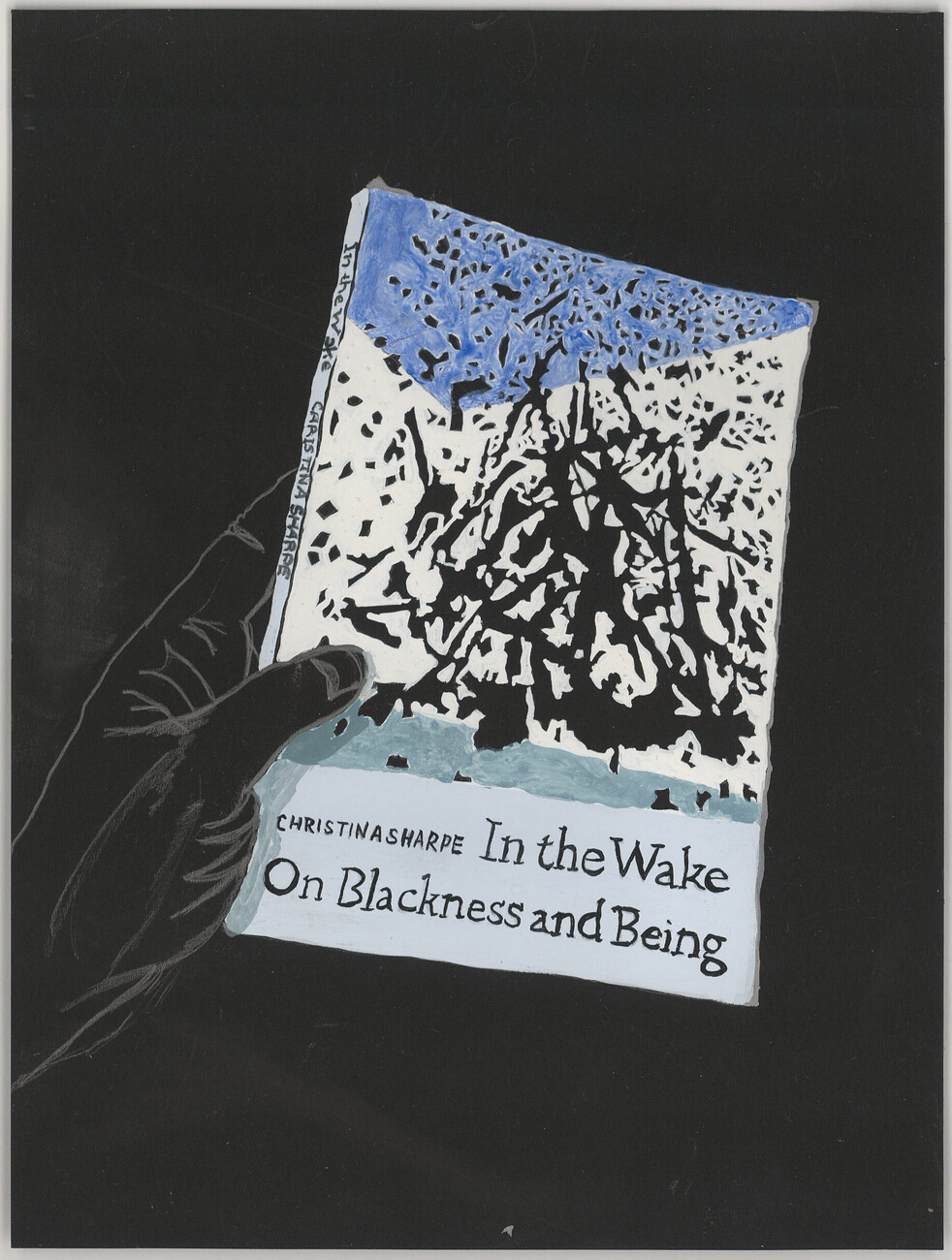 black background, hand holding blue and white book