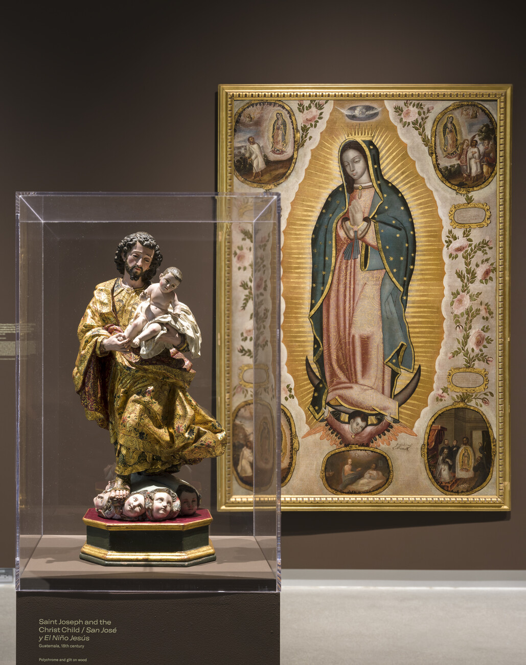 sculpture in foreground, painting in background