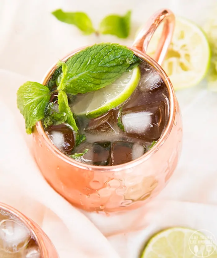 A drink with lemon and mint.