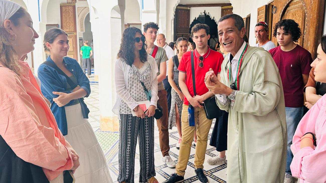 students gathering around a tour guide