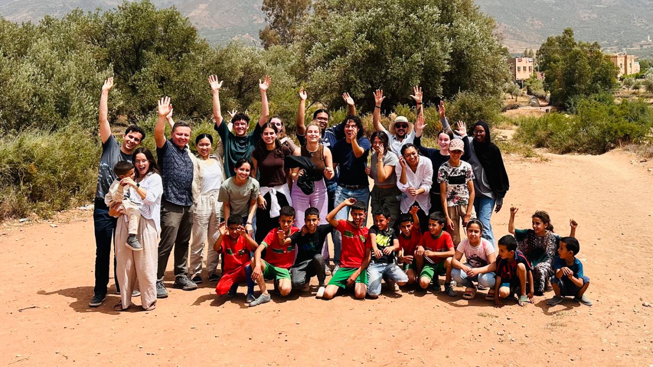 photo of college students and local children and adults in Marrakesh