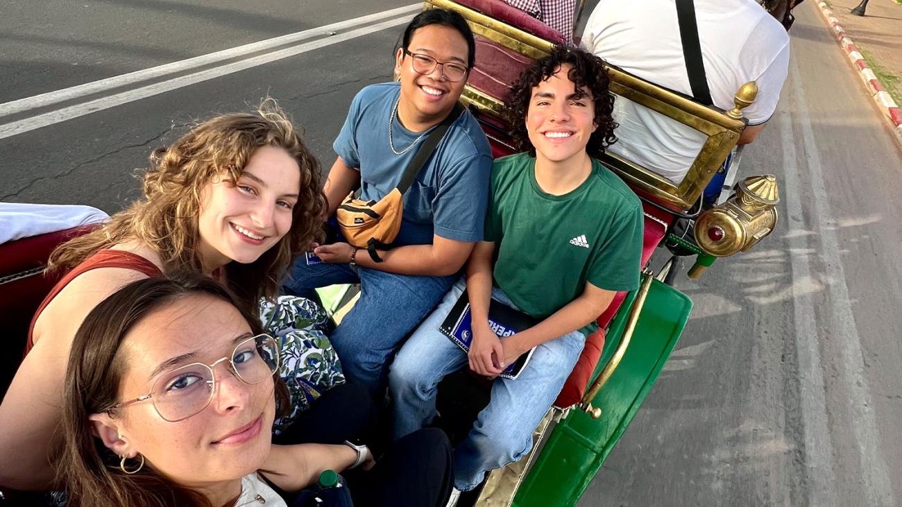 photo of students riding in a carriage in Morocco