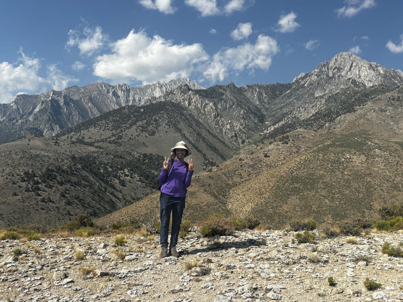 Khadi Diallo '26 stands in front of mountain ranges