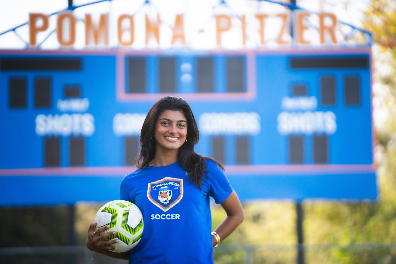 Anjali Nuggenhalli holds a soccer ball