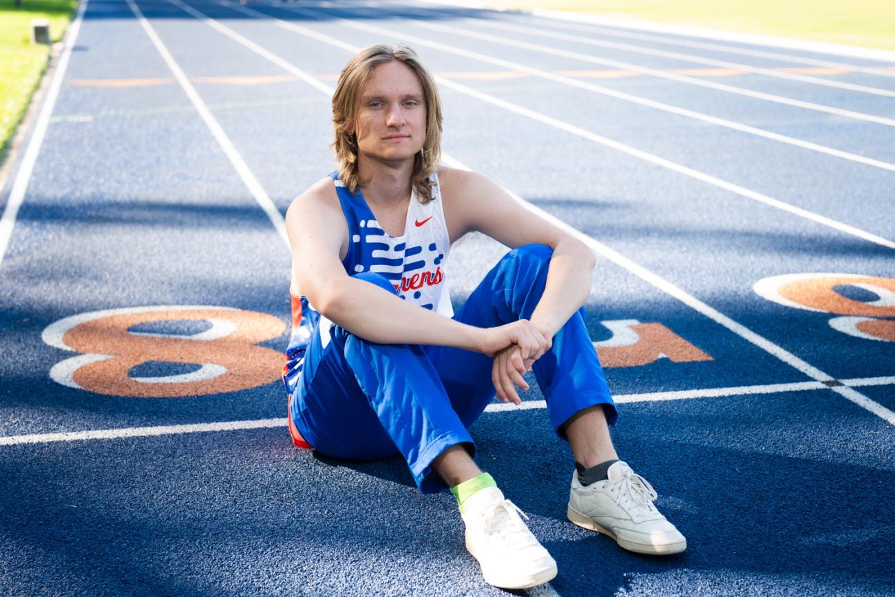 Joseph Cox sits on a track