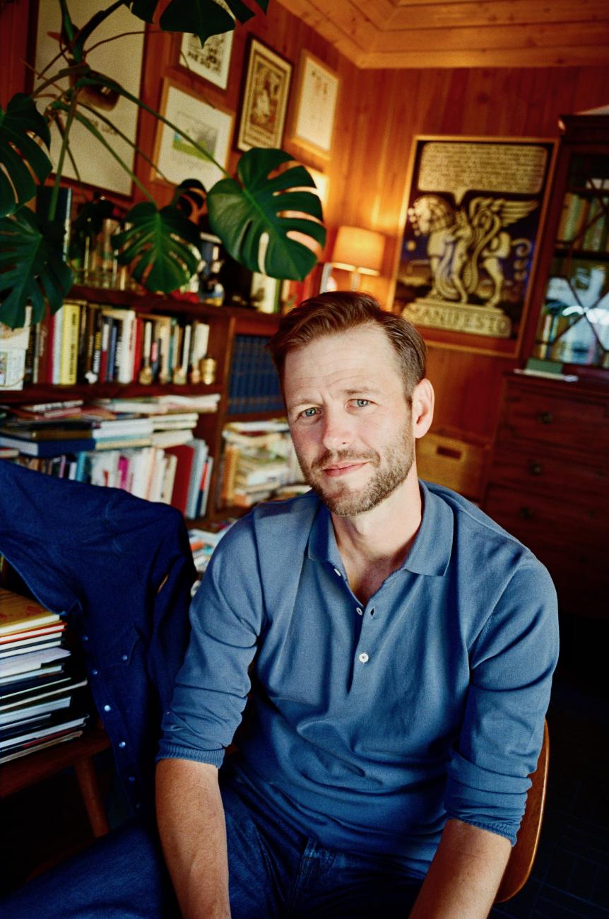 Mac Barnett sits in his home office