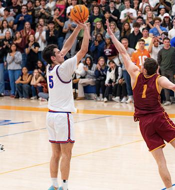 Joe Cookson shoots during a basketball game