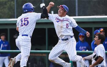 Ng and teammate jump in celebration after a win