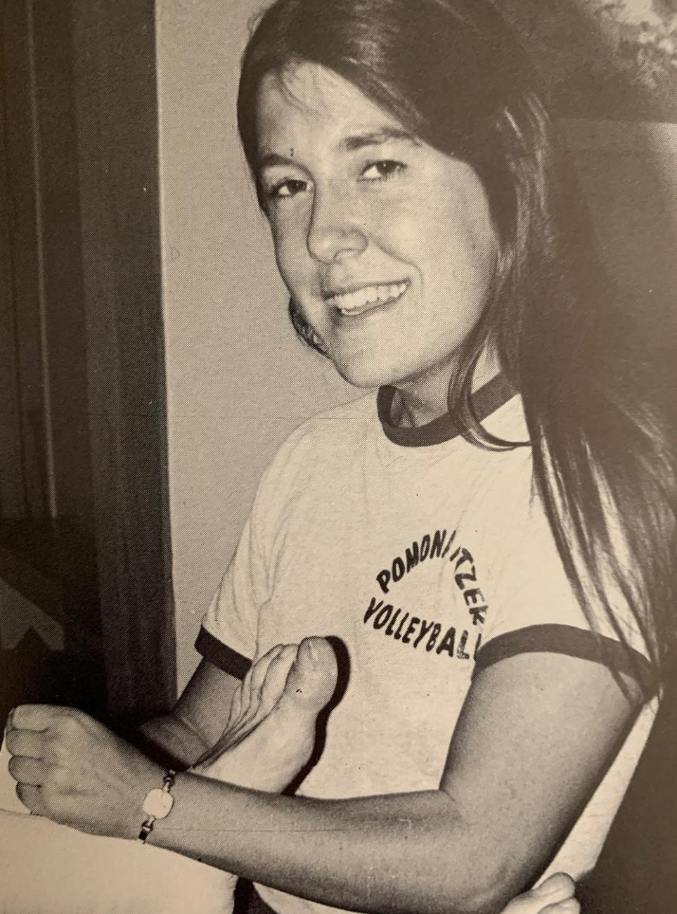 A black and white photo of alumna Nancy Treser-Osgood, Class of 1980, as a varsity Sagehens Women's Volleyball player.