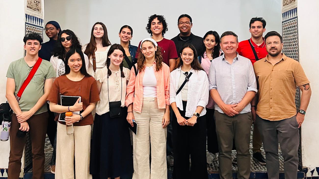 a group of students and professor posting for a picture