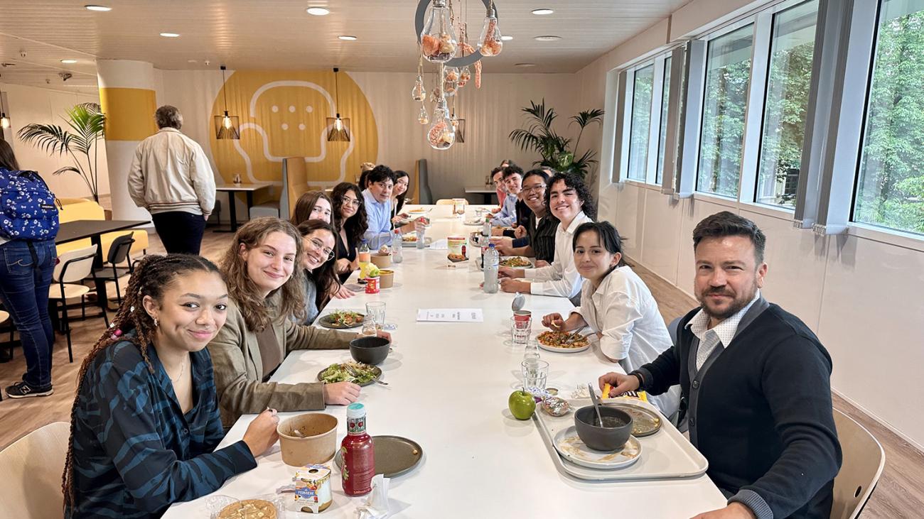 students dining with faculty in Belgium for faculty led study away trip