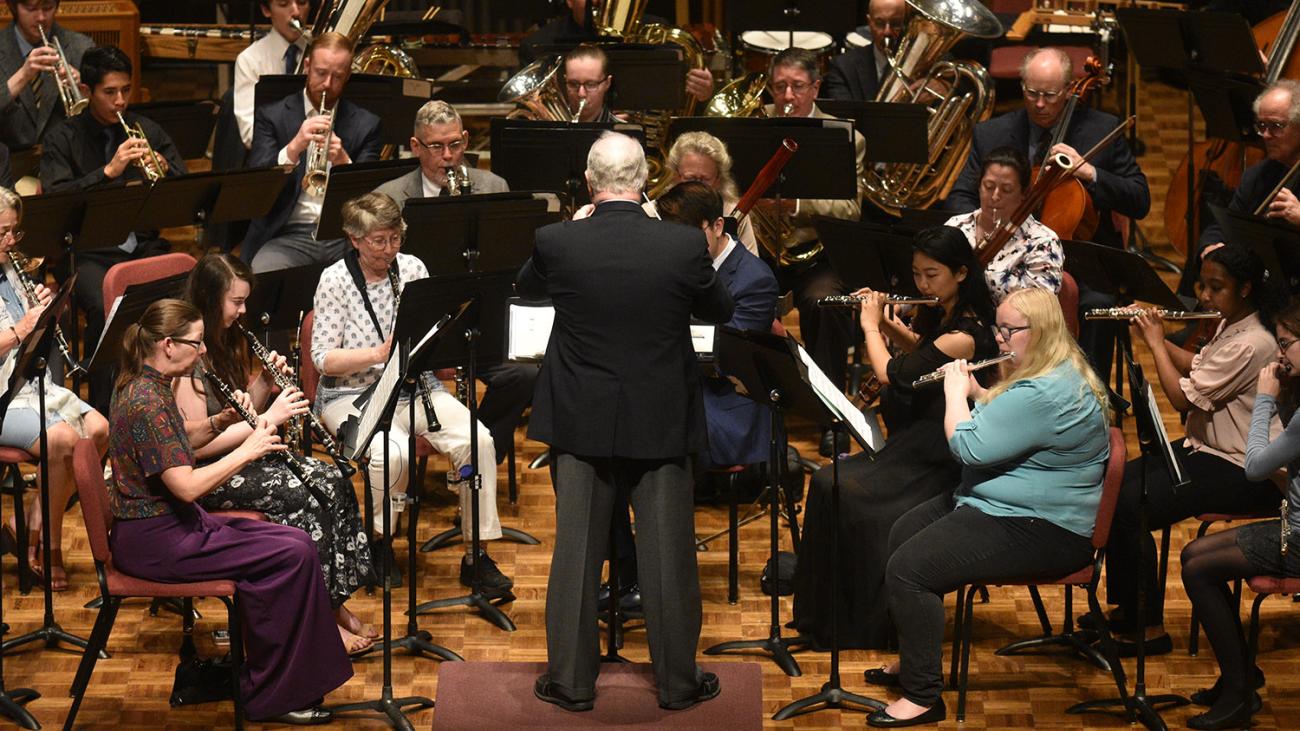 Pomona College band performs on stage.