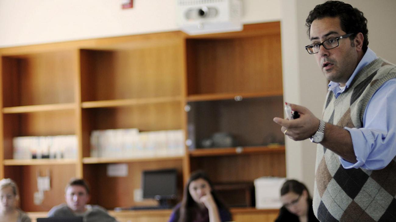 Professor Lozano teaching students in a classroom