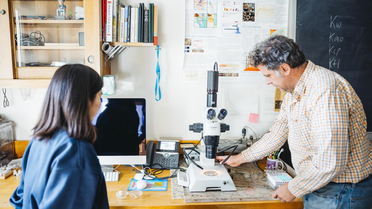Photo of student and professor working in the lab together.