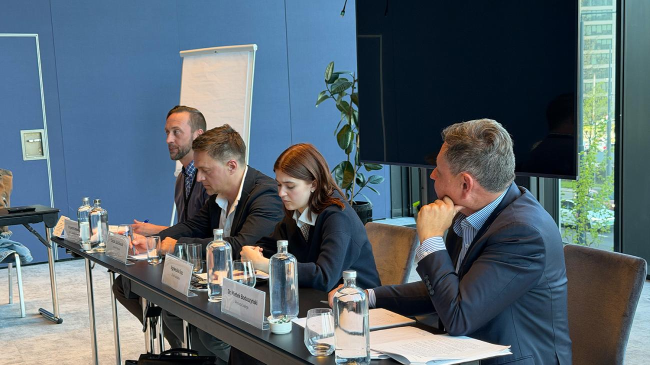 Boduszynski at right moderates a panel